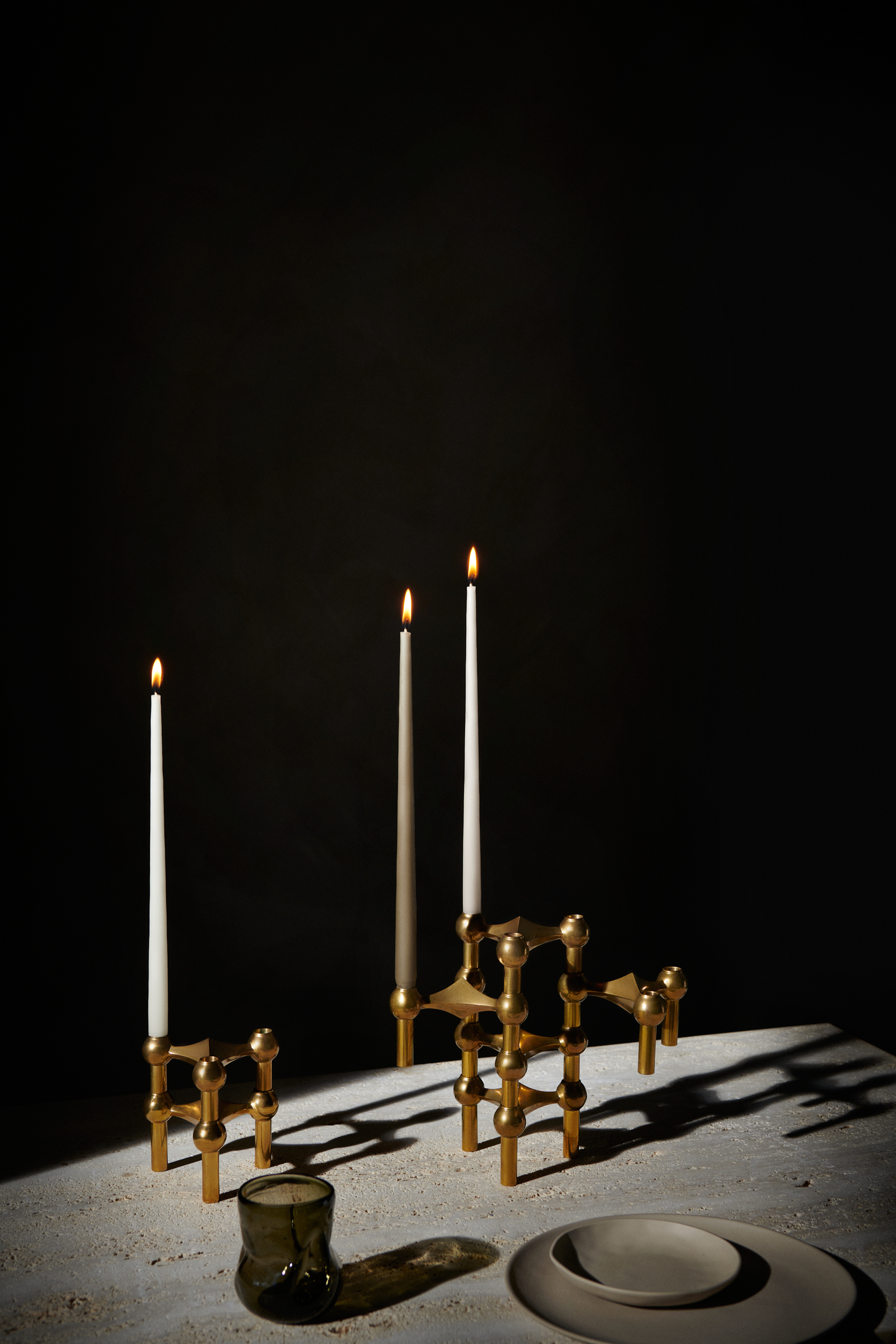studio_aw21campaign_candle holder oxydised and taper candles in off white and taupe_solid brass.